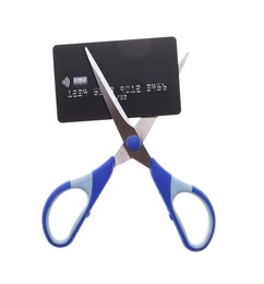 Photo of Credit card and scissors isolated on white