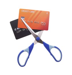 Photo of Credit cards and scissors isolated on white