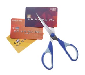 Photo of Credit cards and scissors isolated on white