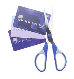 Photo of Credit cards and scissors isolated on white