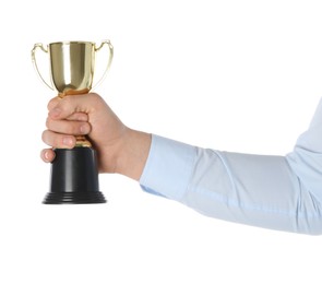 Man with golden trophy cup on white background, closeup