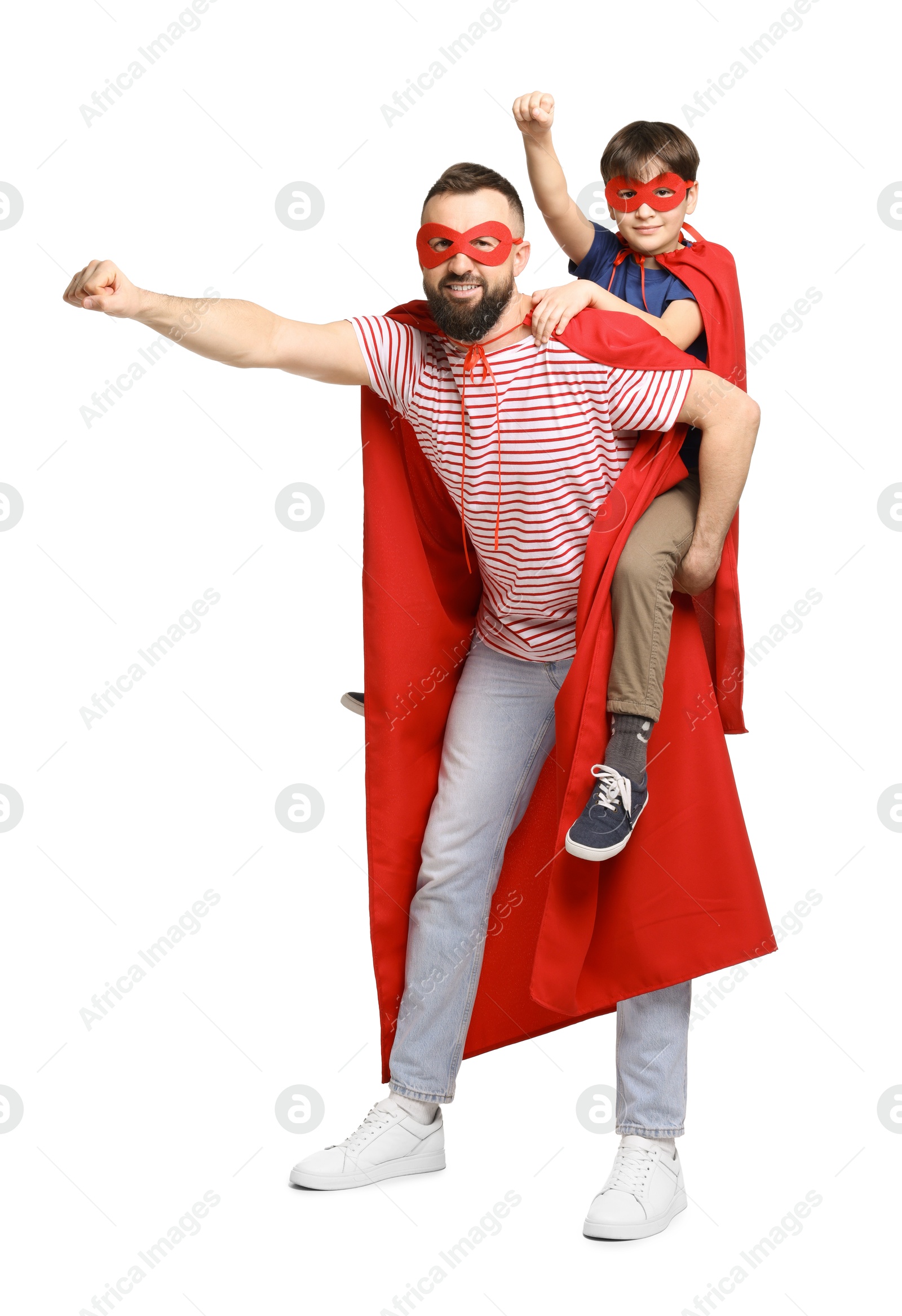 Photo of Father and his son wearing superhero costumes on white background