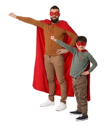 Photo of Father and his son wearing superhero costumes on white background