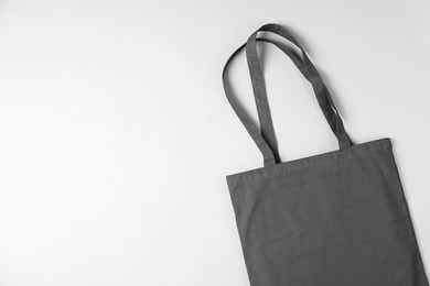 Photo of One shopping bag and space for text on grey background, top view. Mockup for design