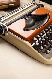 Photo of Vintage typewriter and sheet of paper on table, closeup