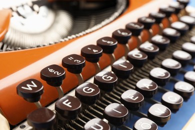 Photo of Old vintage typewriter machine as background, closeup