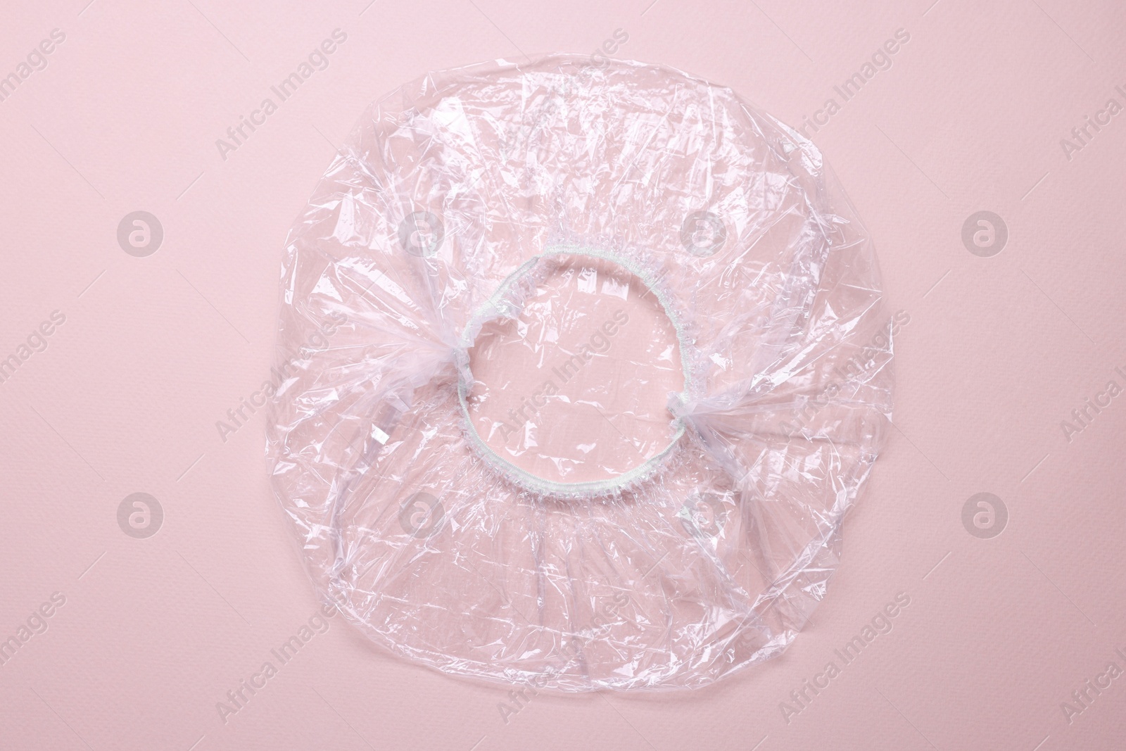 Photo of One shower cap on beige background, top view