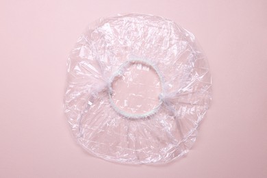 Photo of One shower cap on beige background, top view