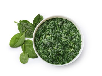 Delicious spinach sauce in bowl and leaves isolated on white, top view