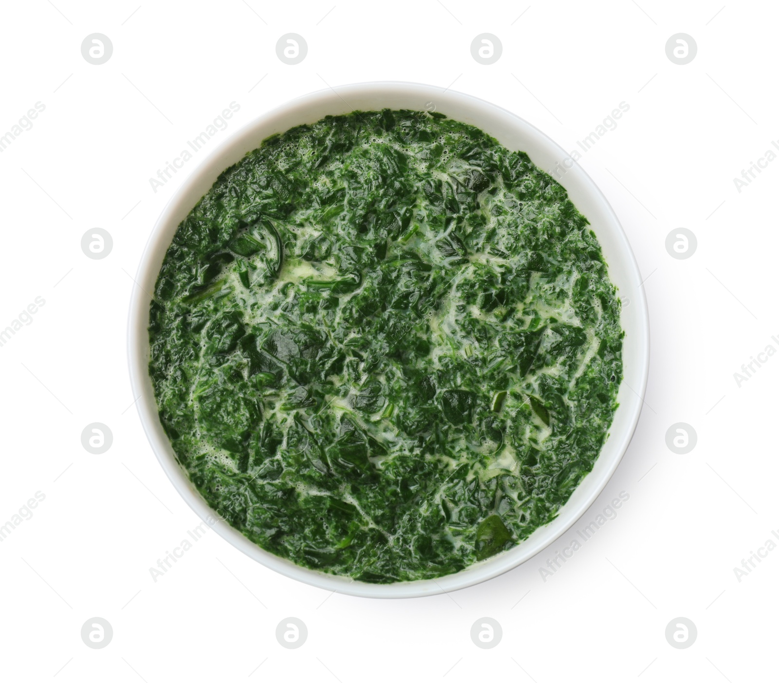 Photo of Delicious spinach sauce in bowl isolated on white, top view