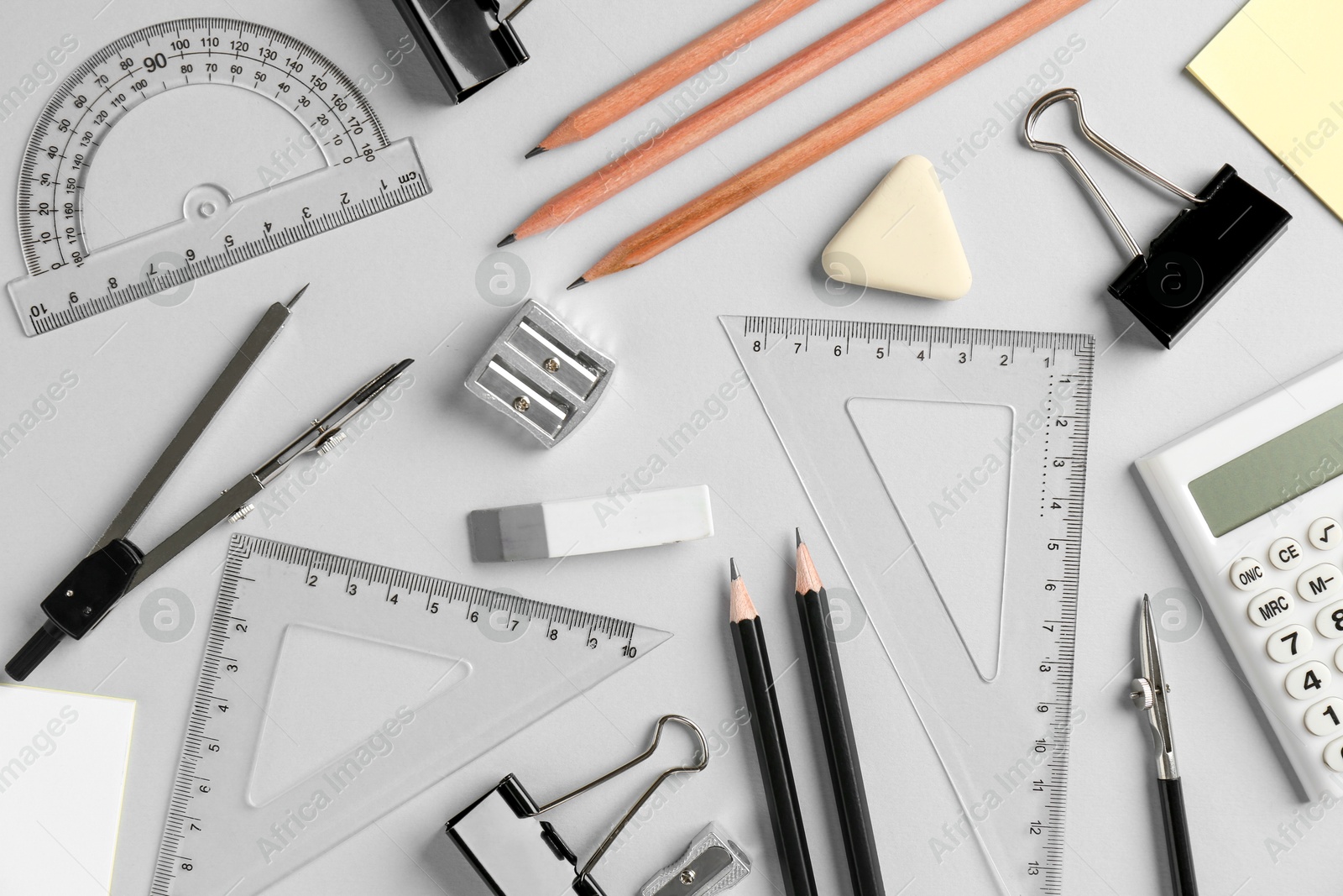 Photo of Flat lay composition with ruler and other stationery on light grey background