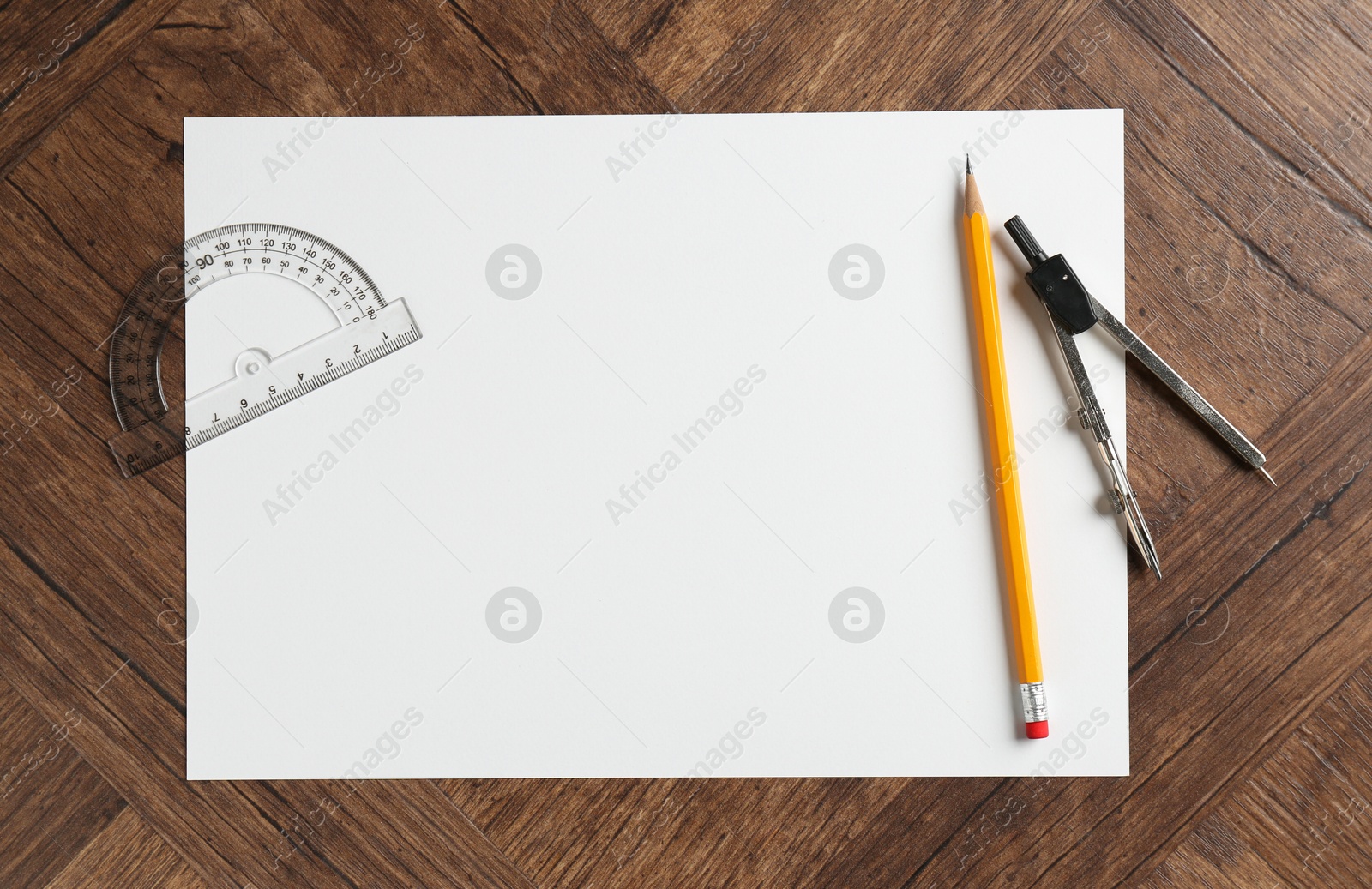 Photo of Ruler, paper, compass and pencil on wooden table, flat lay. Space for text