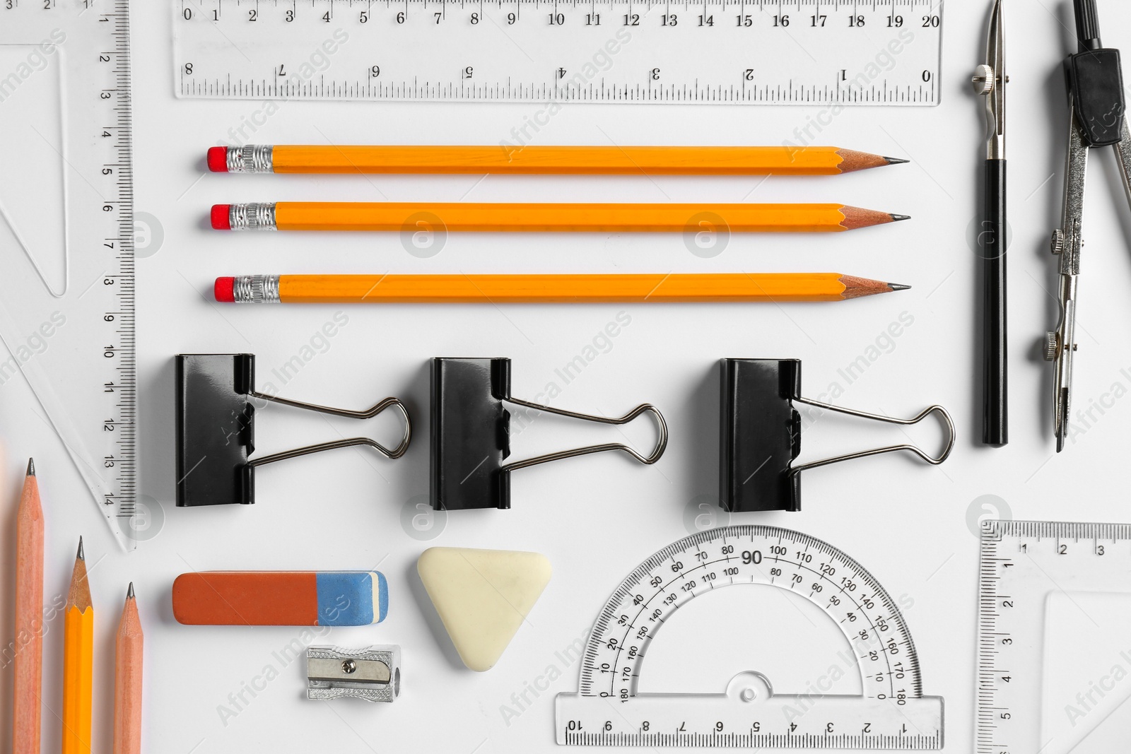 Photo of Flat lay composition with ruler and other stationery on white background