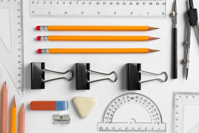 Photo of Flat lay composition with ruler and other stationery on white background