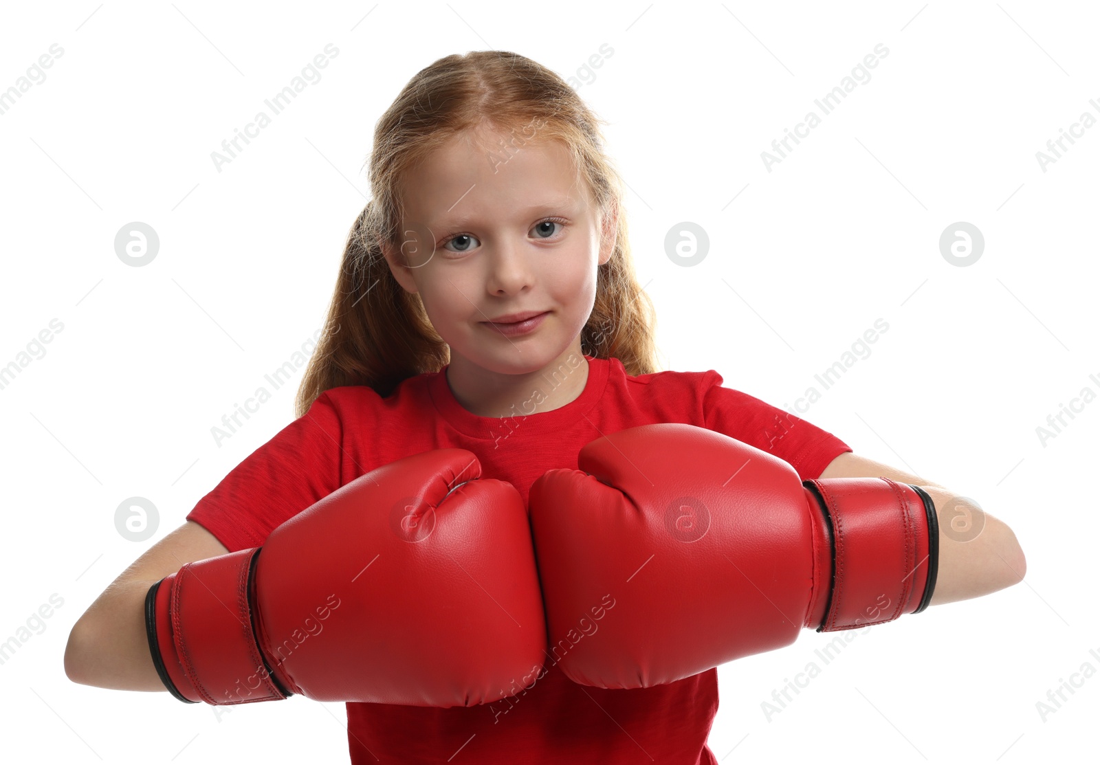 Photo of Cute little girl with boxing gloves on white background