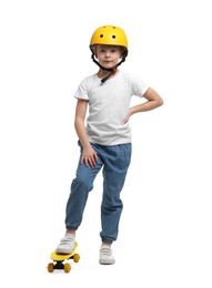 Photo of Little girl in helmet with penny board on white background