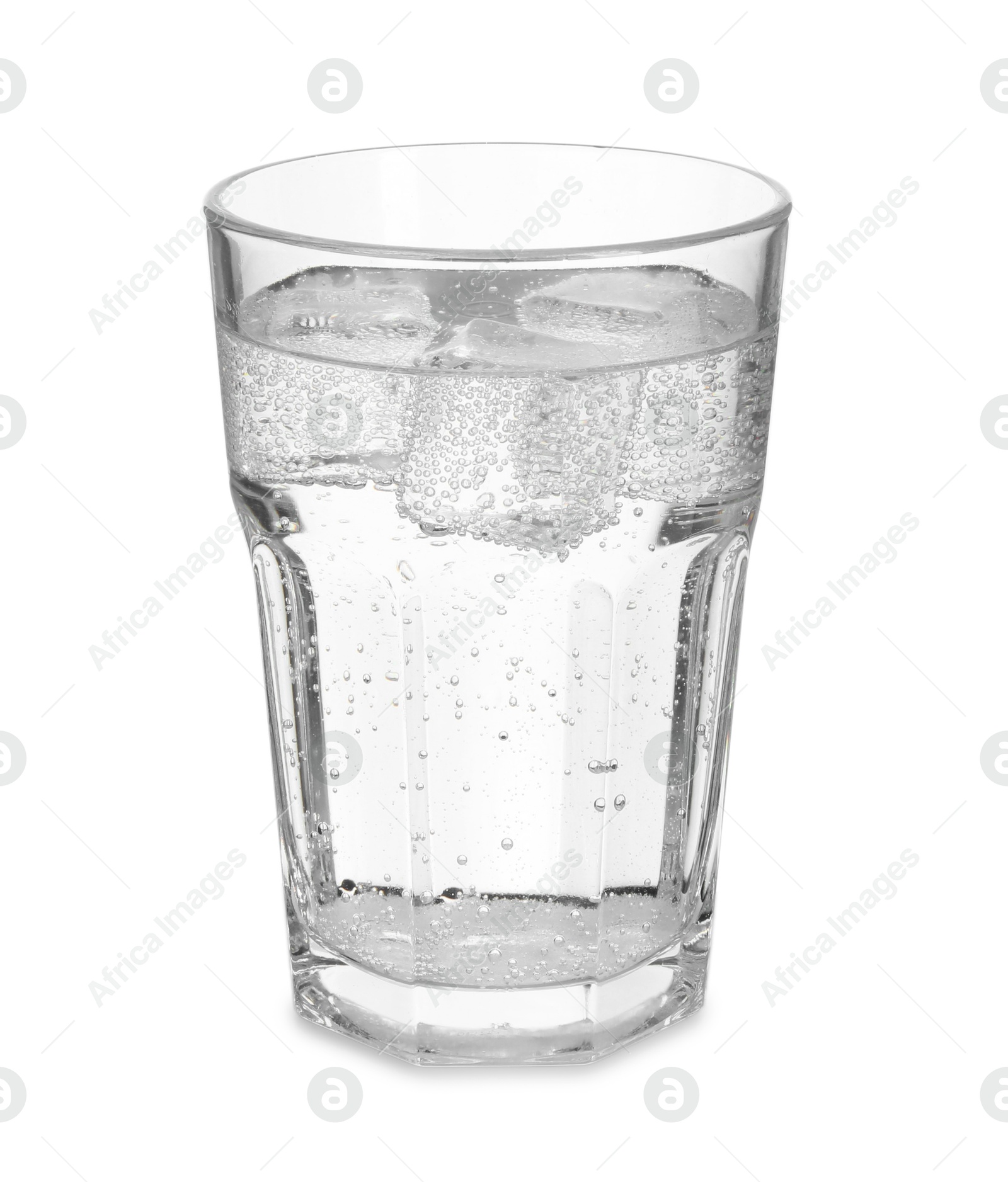 Photo of Glass of refreshing soda water with ice cubes isolated on white