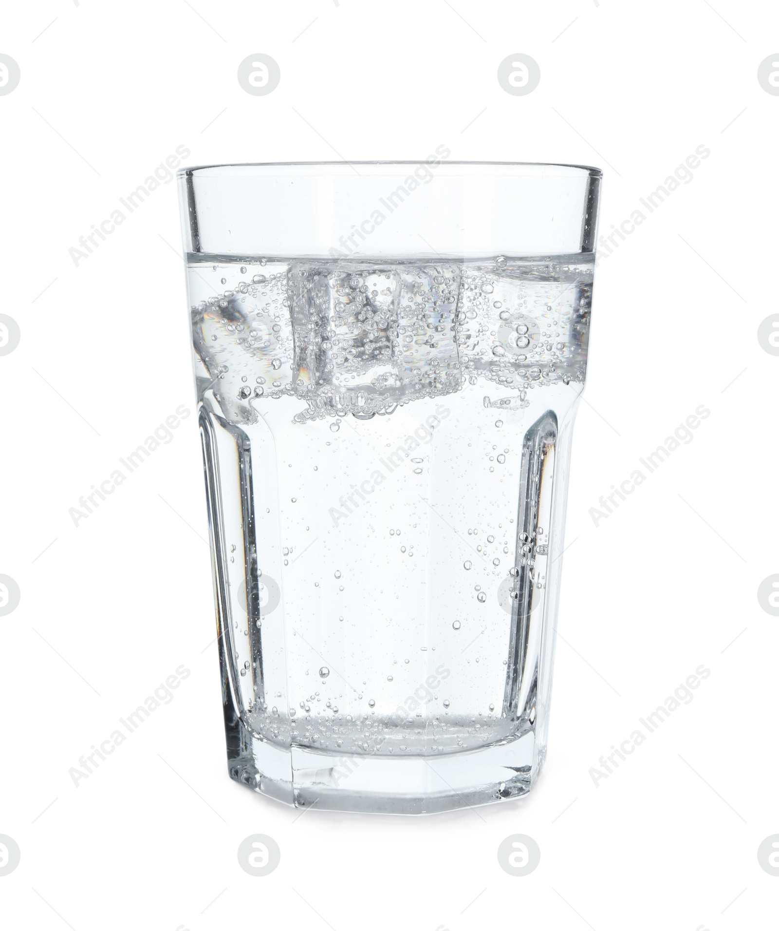 Photo of Glass of refreshing soda water with ice cubes isolated on white