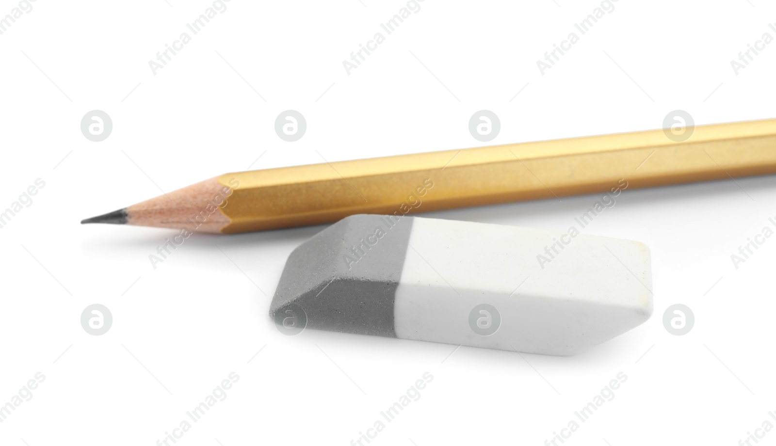 Photo of Eraser and pencil isolated on white. School stationery