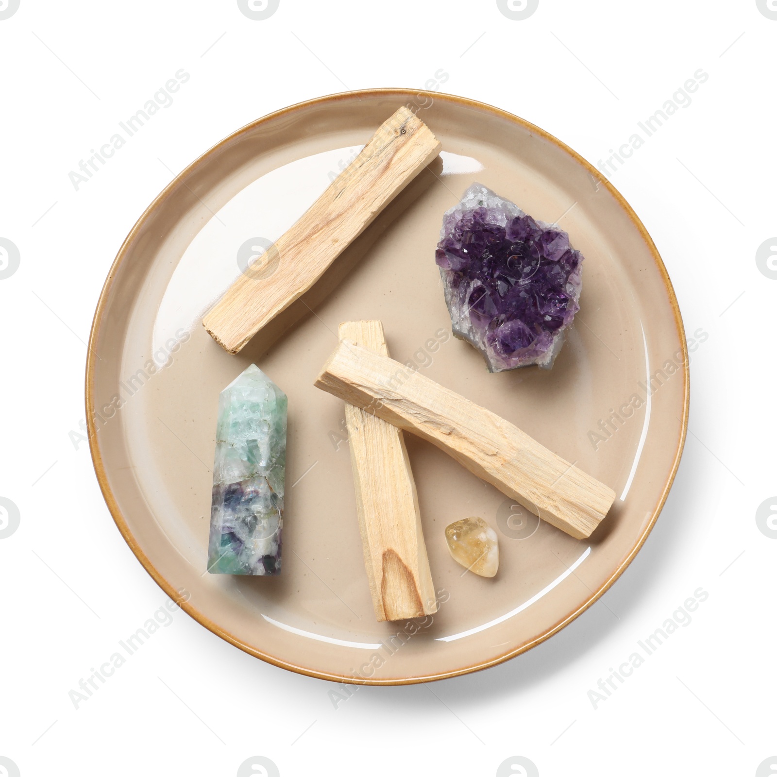 Photo of Palo santo sticks and gemstones isolated on white, top view