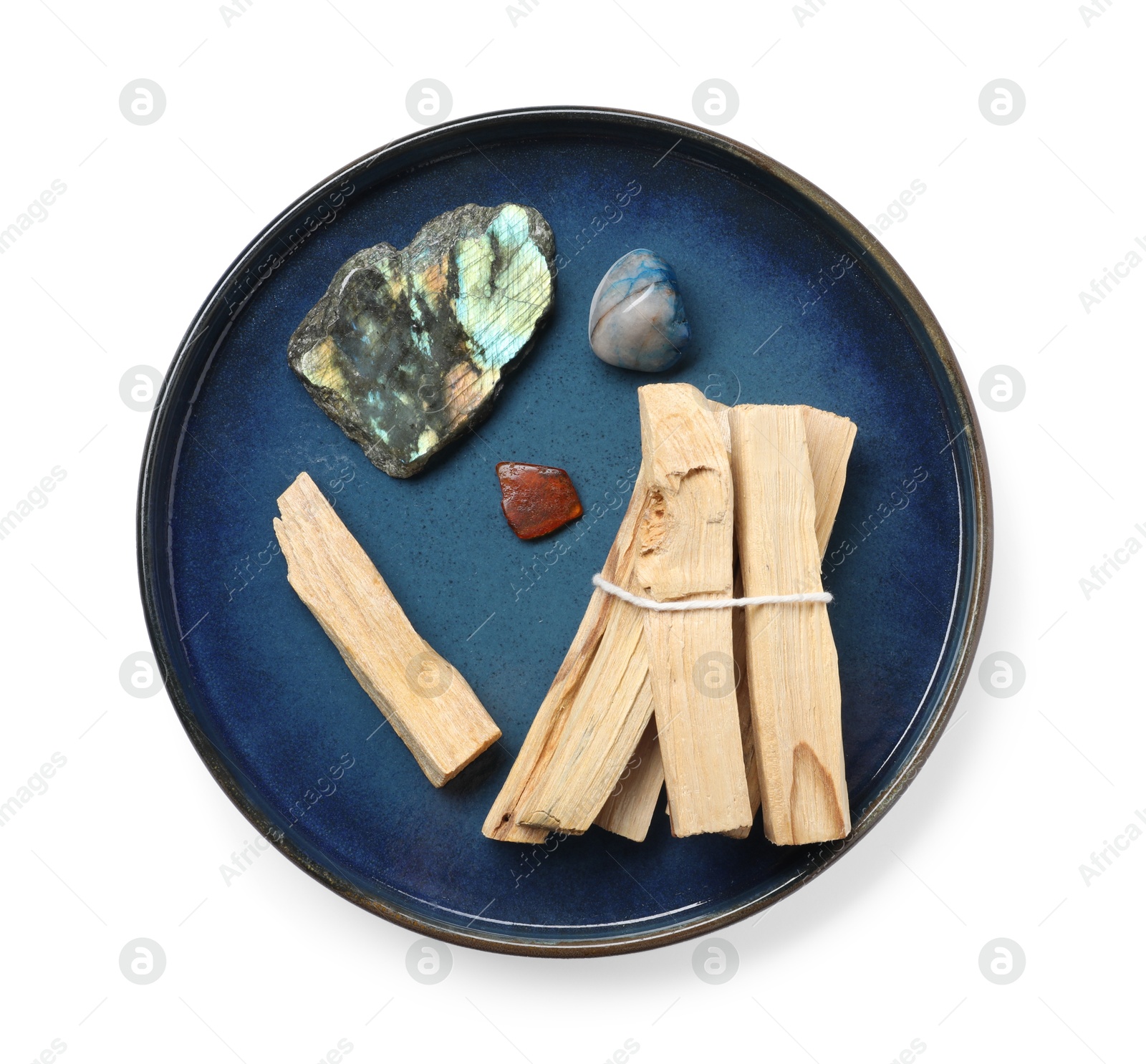 Photo of Palo santo sticks and gemstones isolated on white, top view