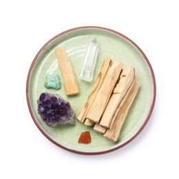 Photo of Palo santo sticks and gemstones isolated on white, top view