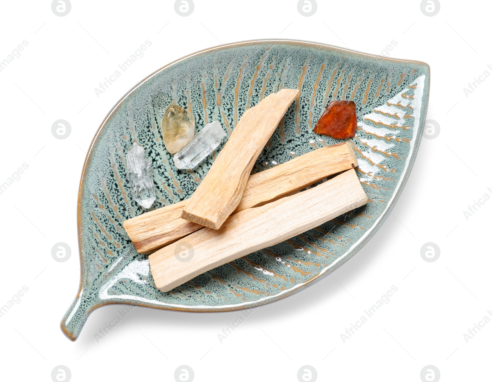 Photo of Palo santo sticks and gemstones isolated on white, top view