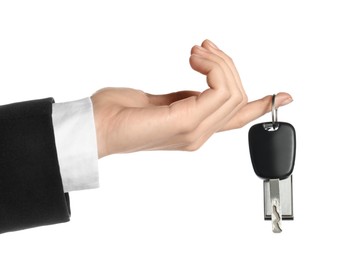 Photo of Woman with car key and keychain on white background, closeup