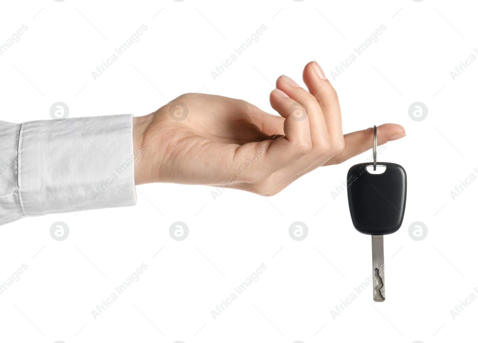 Woman with car key on white background, closeup Photo of Woman with car key on white background, closeup