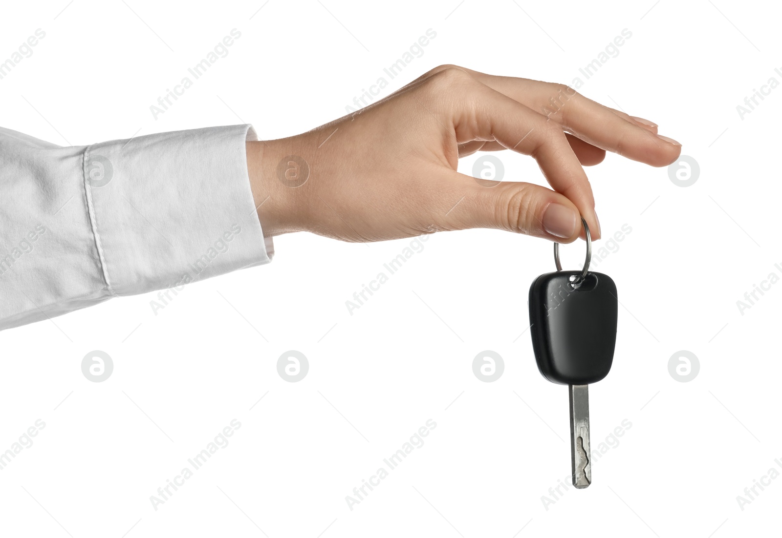 Woman with car key on white background, closeup Photo of Woman with car key on white background, closeup