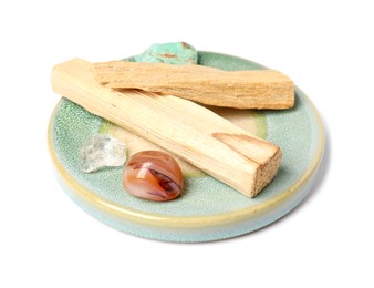 Photo of Palo santo sticks and gemstones isolated on white