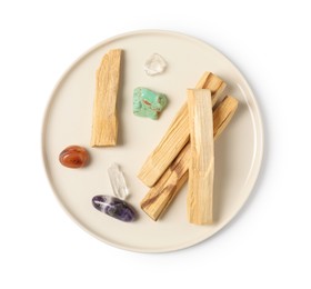 Photo of Palo santo sticks and gemstones isolated on white, top view