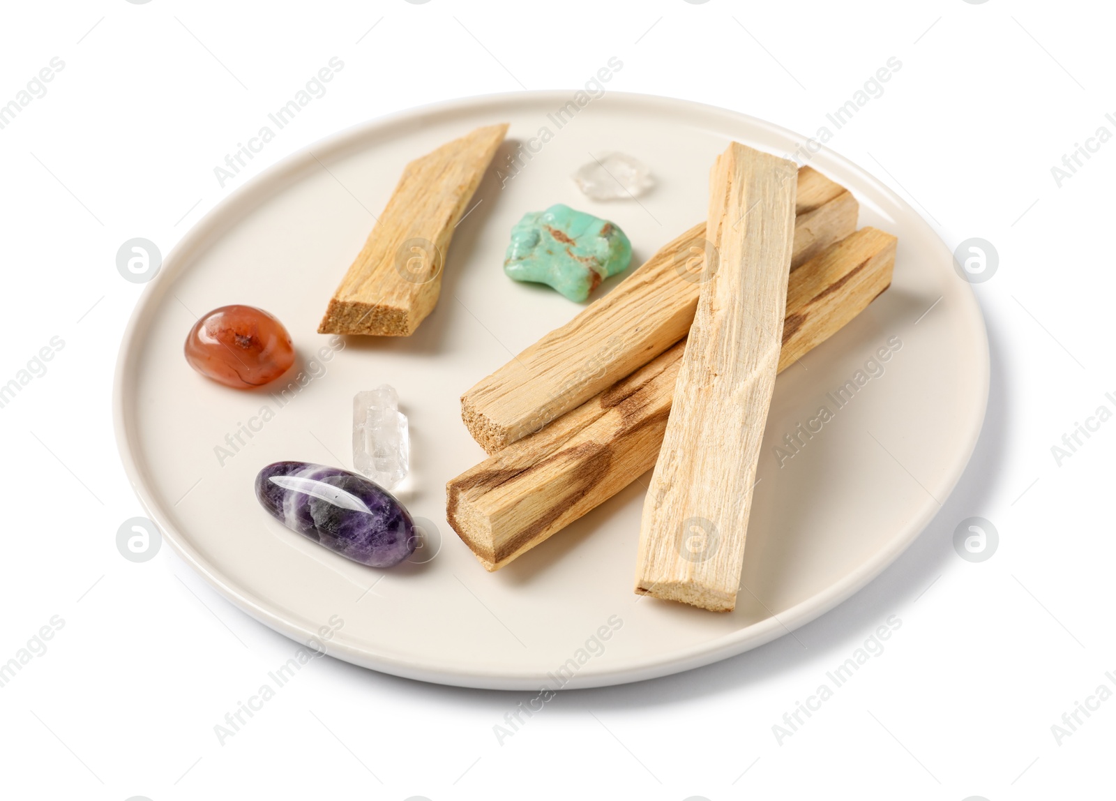 Photo of Palo santo sticks and gemstones isolated on white