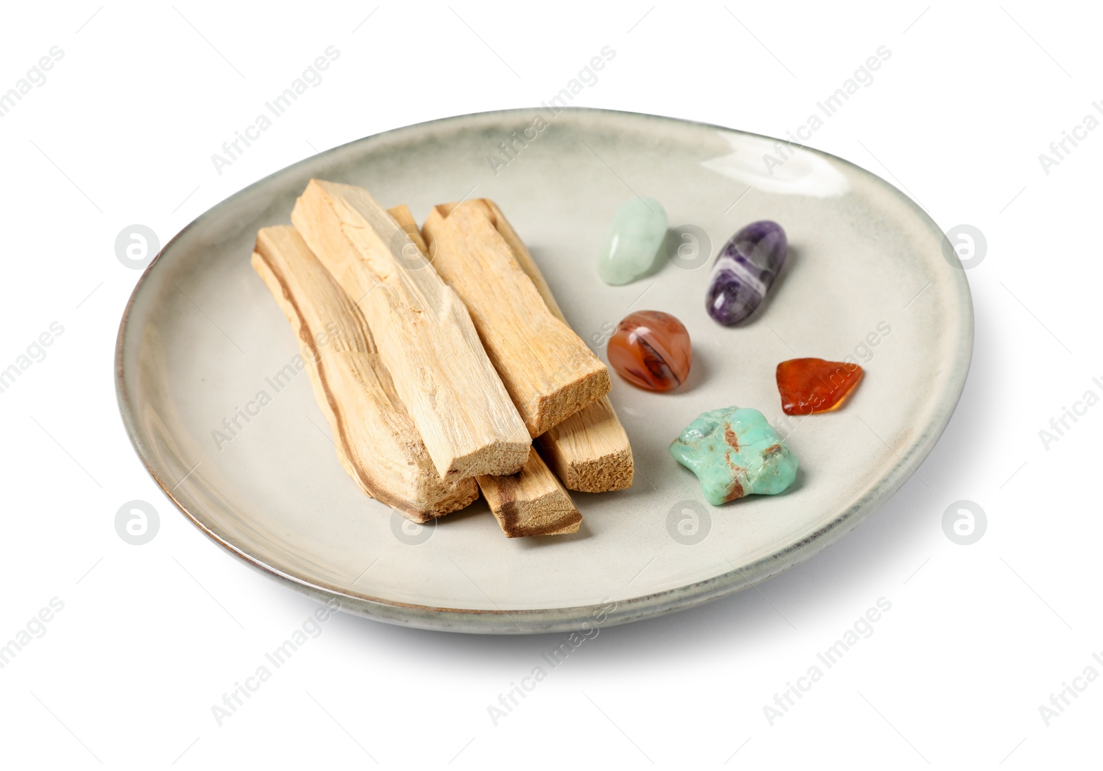 Photo of Palo santo sticks and gemstones isolated on white