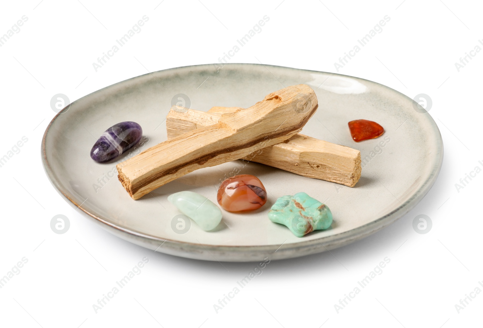 Photo of Palo santo sticks and gemstones isolated on white