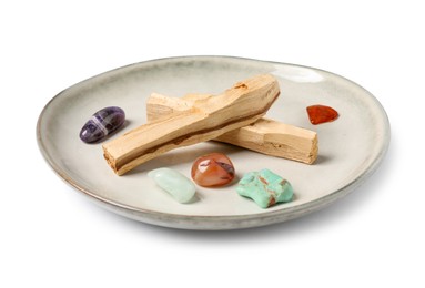 Photo of Palo santo sticks and gemstones isolated on white