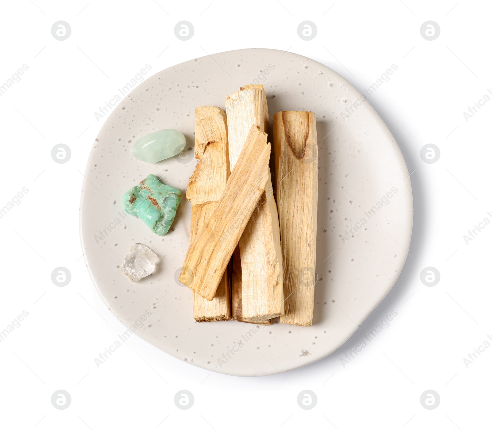 Photo of Palo santo sticks and gemstones isolated on white, top view