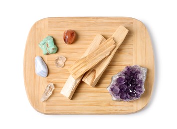 Photo of Palo santo sticks and gemstones isolated on white, top view