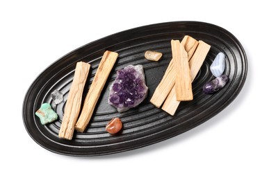 Photo of Palo santo sticks and gemstones isolated on white, top view