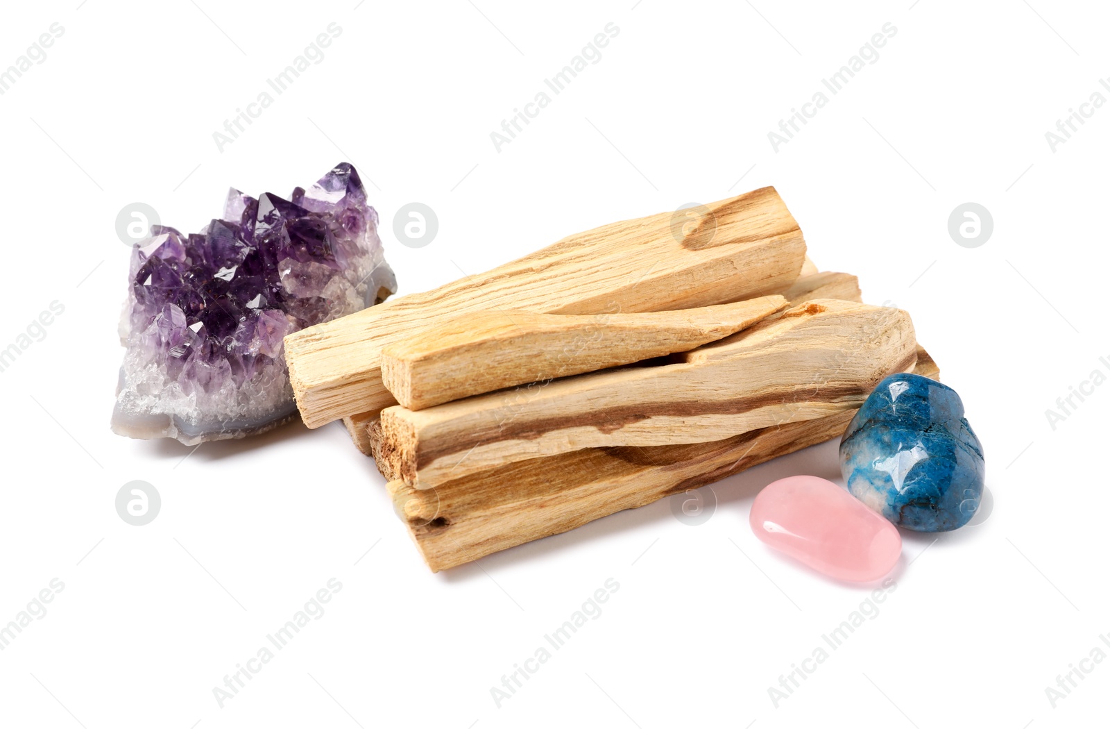 Photo of Palo santo sticks and gemstones isolated on white