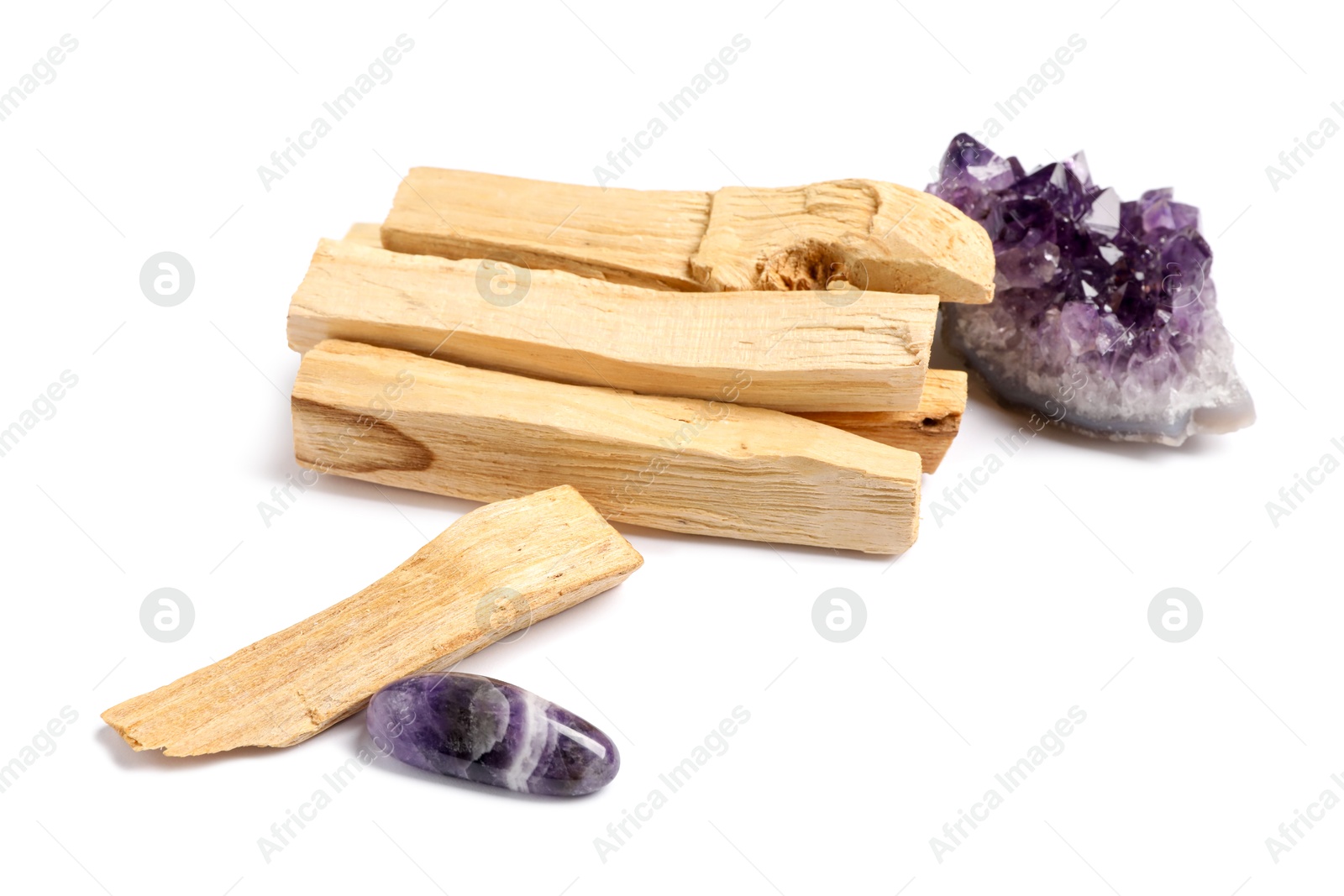 Photo of Palo santo sticks and gemstones isolated on white