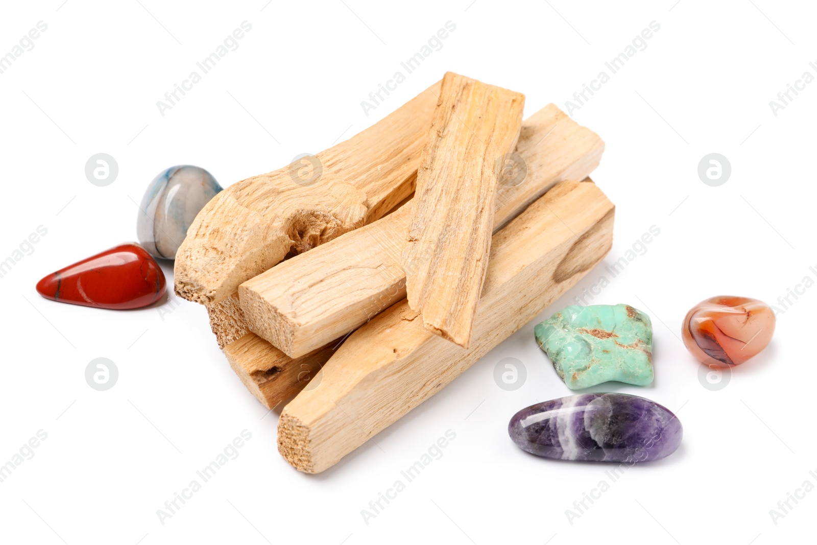 Photo of Palo santo sticks and gemstones isolated on white