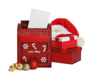 Photo of Santa Claus mail box with hat, letter and gifts isolated on white. Christmas tradition