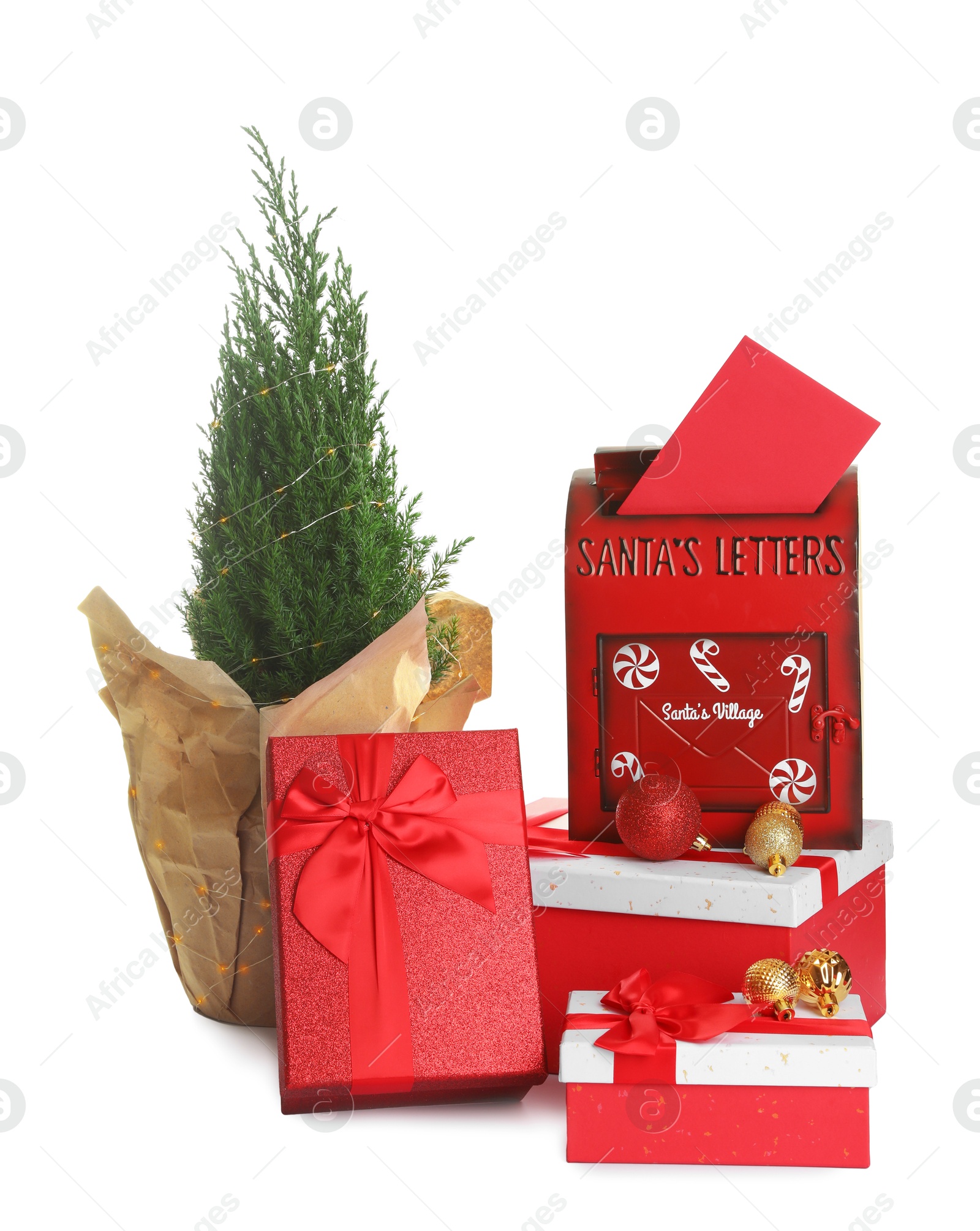 Photo of Santa Claus mail box with letter, gifts and juniper plant isolated on white. Christmas tradition