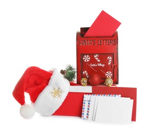 Photo of Santa Claus mail box with hat, gift and letters isolated on white. Christmas tradition