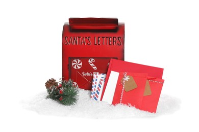 Photo of Santa Claus mail box with letters, pine branch and artificial snow isolated on white. Christmas tradition