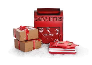 Photo of Santa Claus mail box with letters, gifts and artificial snow isolated on white. Christmas tradition