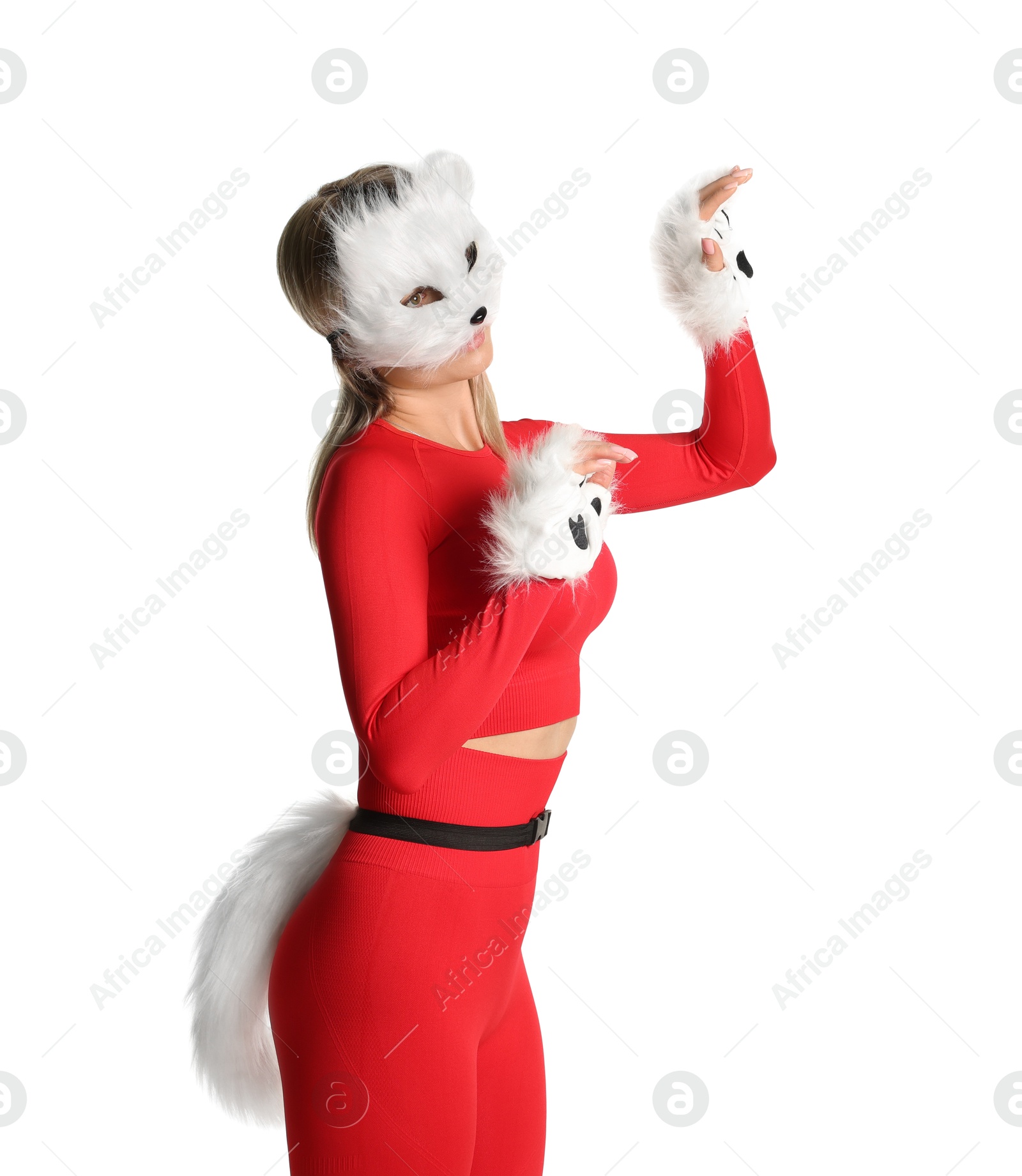 Photo of Quadrobics. Woman wearing cat mask, gloves and tail on white background