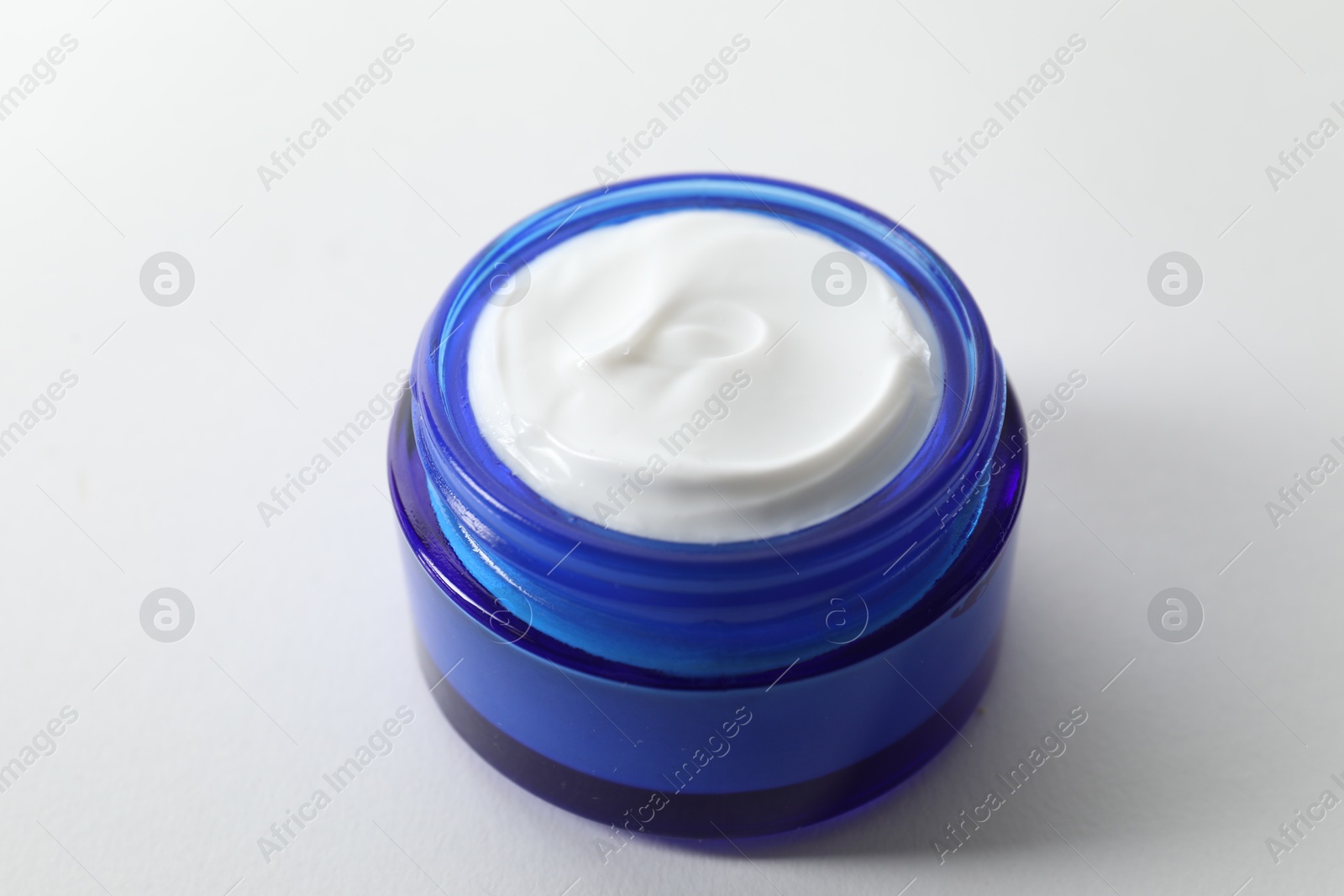 Photo of Jar of cream on white background, closeup