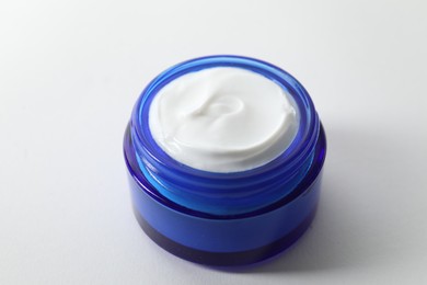 Jar of cream on white background, closeup